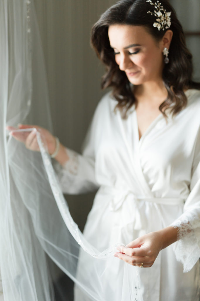 bride looking at her veil
