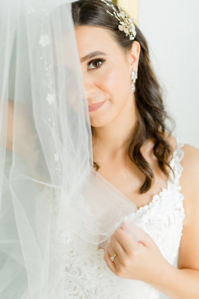 bride with veil covering her eye